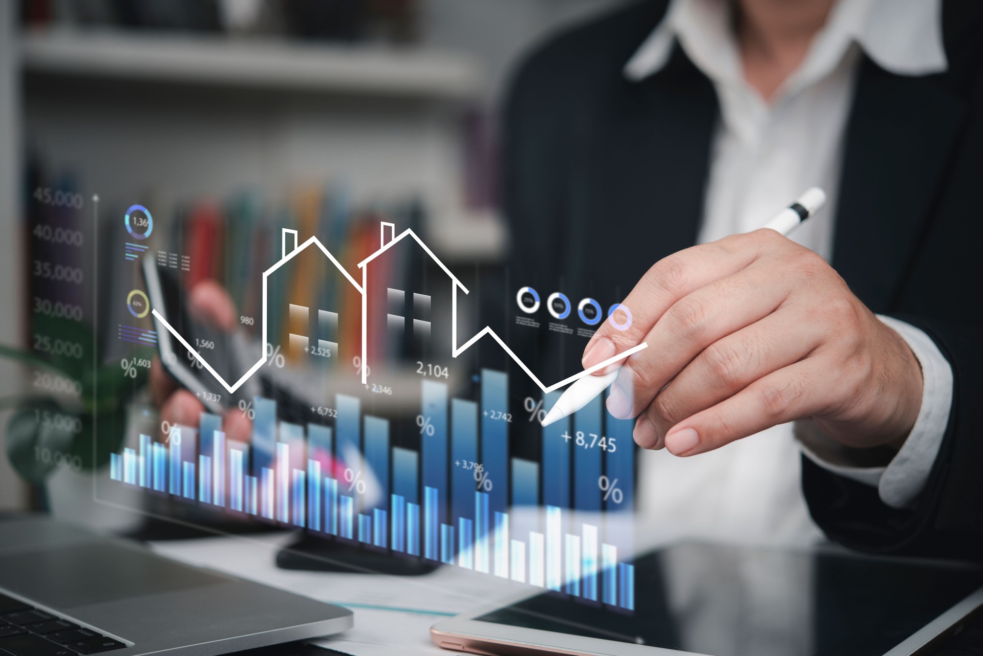 investor or developer digital stylus with virtual graph real estate data. market analysis and financial planning for successful property investment.